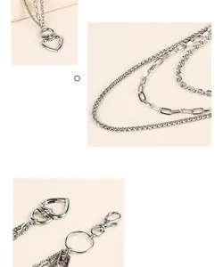 Close-up of multilayer silver metal pant chain featuring a 360-degree rotating clasp