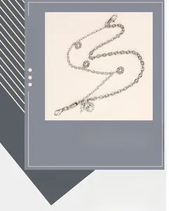 Detailed view of hip hop silver metal trouser chain with star dragon pendant