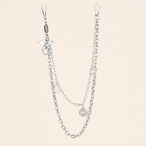 Detail view of multi-layer silver pants chain with dragon and pentagram star pendants