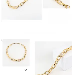 Detailed close-up of golden punk hip-hop pants chain with polished oval ring links
