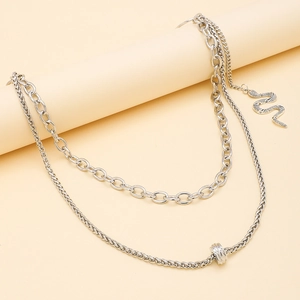 Double-layered silver snake pendant necklace with oval link chain and polished finish