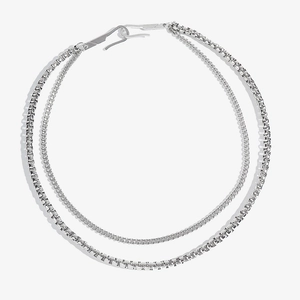 Close-up of double layer silver chain featuring box and curb links with metal hook clasp