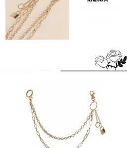 Detailed view of multilayer gold metal pants chain featuring a round link and padlock pendant