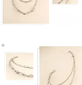 Detail showing double-layered silver punk waist chain with lobster clasps and thorns