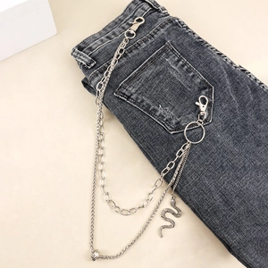 Multi-layer silver metal pants chain featuring a snake pendant on dark grey jeans