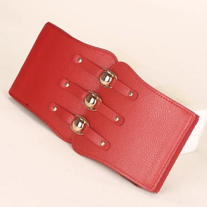 Detail of red PU leather corset belt featuring triple gold metal ball buckles and textures