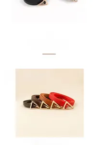 Detail showing minimalist leather belts for women with unique gold triangle metal buckles