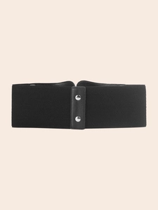Close-up of black elastic waist belt featuring silver rivets and faux leather detail