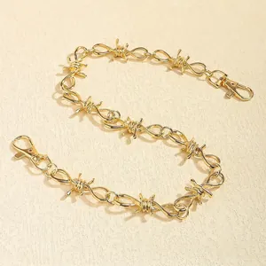 Fashionable gold-tone metal pant chain with twisted thorn barbed wire link design