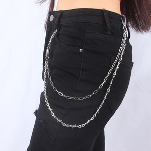 Close-up of double-layer silver punk pant chain with thorn-shaped wire and metal carabiner