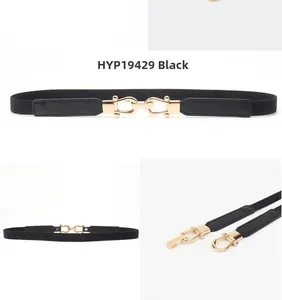 Detail of elastic black skinny belt with gold horse-bit buckle for women dresses