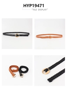 Detail of woven elastic belts in black and brown with round golden pin buckles
