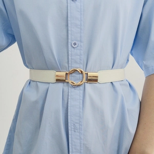 Elastic white belt with interlocking gold rings on a light blue dress shirt