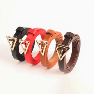Detailed view of women's leather belts with golden triangle buckles in four classic colors
