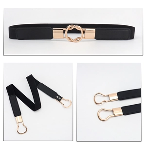 Close-up of interlocking gold double rings on a slim black elastic waist belt