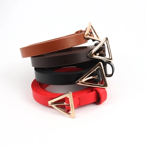 Detail of four colorful leather belts for women with golden triangle metal buckles