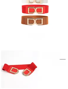 Detail view of elastic waist belts in white, red and brown with gold metal buckles