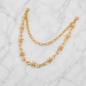 Detail of double-layer gold punk waist chain featuring a unique thorn barbed wire design