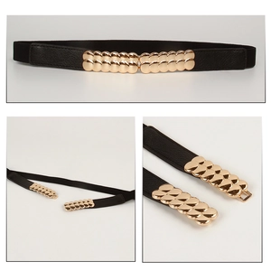 Detail view of women's black elastic waist belt with elegant gold metal buckle