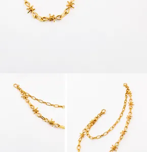 Detail view of golden alloy punk trousers chain with thorn and oval link design