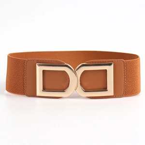 Close-up of the caramel brown elastic waist belt with a large golden double D-buckle detail