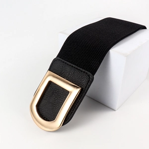Detail of black elastic belt featuring premium lychee leather and gold double D-buckle