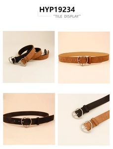 Detail view of heart-shaped silver buckles on vintage faux suede belts in black and brown
