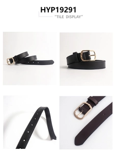 Close-up of vintage leather belt showing golden metal buckle and precise double stitching