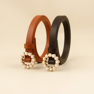 Elegant thin faux leather belt for women with pearl-encrusted gold ring buckle in black and brown