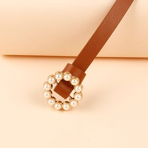 Elegant brown leather belt for women featuring a round gold buckle with inlaid pearls