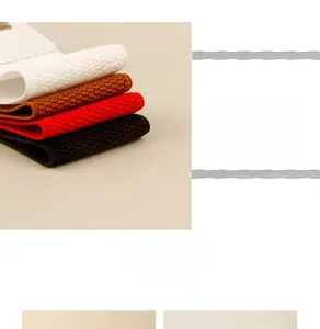 Detail view of elastic woven waist belts in black, brown, red and white with metal buckle