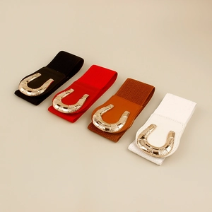 Detailed view of elastic wide belts in black, red, brown, and white with golden buckles