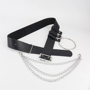 Close-up of punk style wide leather belt with large silver ring and triple metal chains