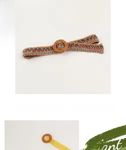 Close-up of bohemian woven belt with pp straw material and vintage wooden buckle