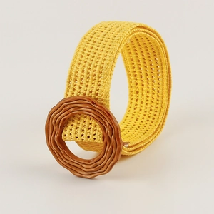 Detailed view of yellow woven straw belt with a textured brown resin buckle