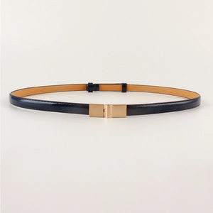Close-up of sleek navy blue patent leather belt with a polished gold square metal buckle