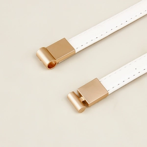 Minimalist white leather belt with gold metal buckle and stitching for dresses