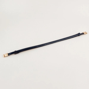 Detail of slim navy blue patent leather belt with polished gold metal T-bar fasteners