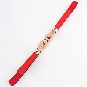 Detail of red elastic waist belt with interlocking gold buckle and crystal rhinestones