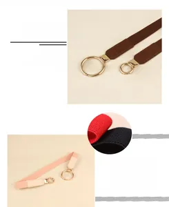 Detail of thin elastic waist belt showing golden round alloy buckle and woven texture
