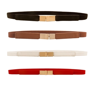 Flat lay of four elastic skinny belts in black brown white and red with gold metal buckles