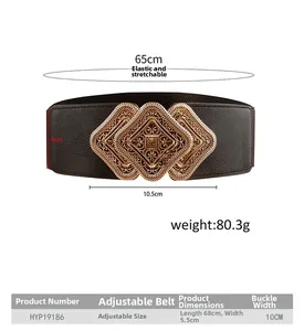 Detailed view of vintage gold hollowed-out buckle on a wide brown elastic waist belt