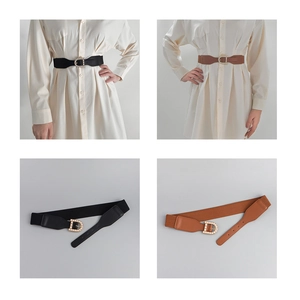 Detail of elastic waist belt featuring D-shaped pearl buckle on black and brown leather