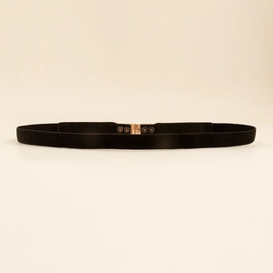 Detail of rose gold square buckle and black elastic woven belt for vintage style