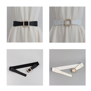 Detailed view of elastic waist belts in black and white with pearl-studded square buckles