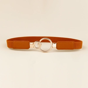 Close-up of brown elastic belt with interlaced gold circular metal buckle for women