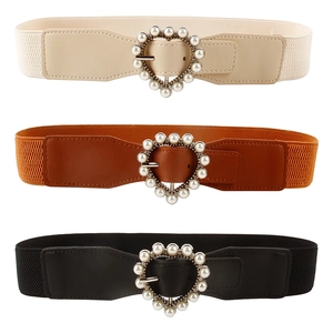 Women's elastic waist belts set in cream, tan, and black with pearl heart buckles
