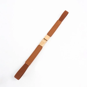 Detail of brown elastic waist belt showing fine stitching and golden buckle