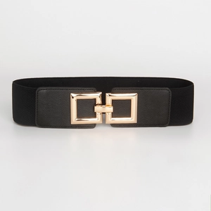 Detail of black elastic wide waist belt featuring elegant square gold buckle design