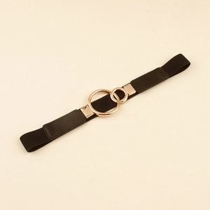 Close-up of black elastic belt with a golden double interlocking ring buckle for women